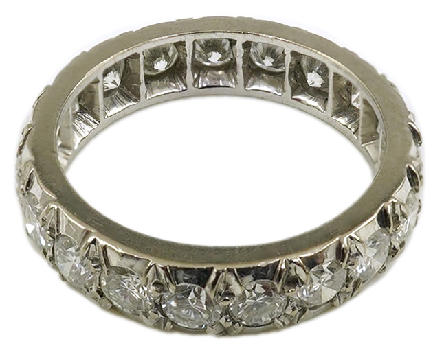 A platinum? and nineteen stone illusion set diamond full eternity ring